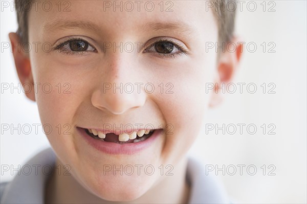 Portrait of boy (8-9) smiling.