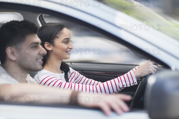 Young couple traveling in car.