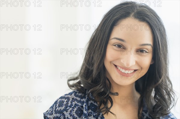 Portrait of smiling young woman .