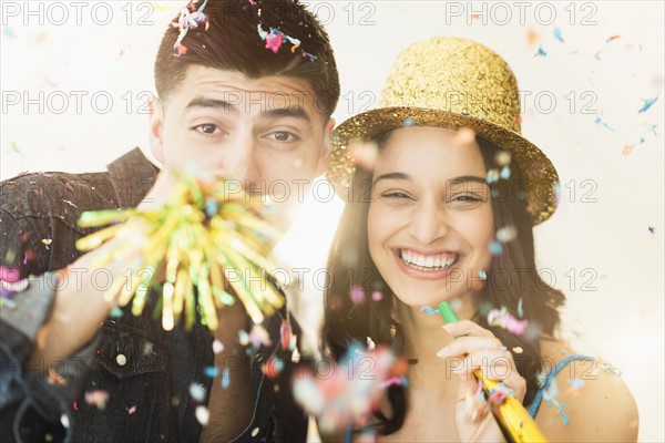 Young couple celebrating New Year's Eve.