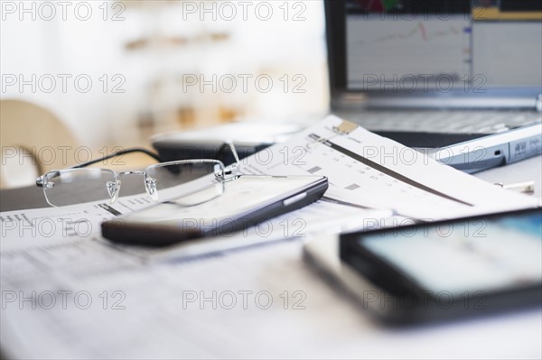 Close up of glasses on paperwork.