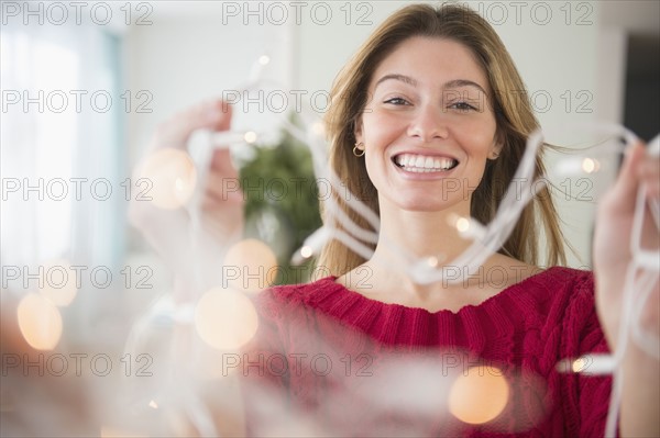 Young woman holding ribbons.
Photo : Jamie Grill