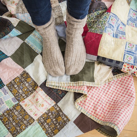 Elevated view of woman's legs wearing woolen socks.
Photo : Jamie Grill