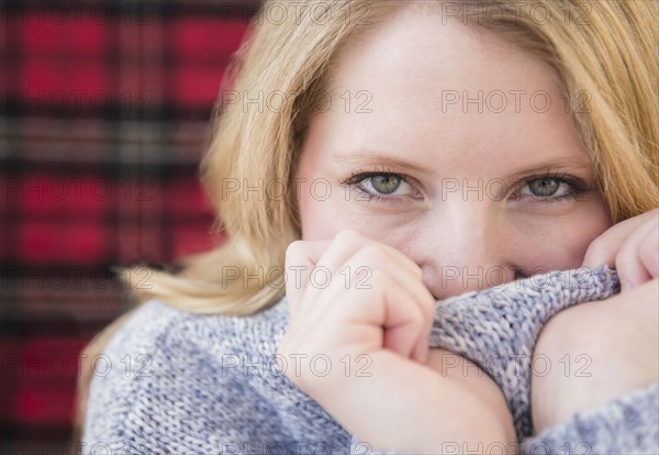 Portrait of blond woman wearing ssweater.
Photo : Jamie Grill