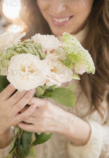 Woman holding bouquet.
Photo : Jamie Grill