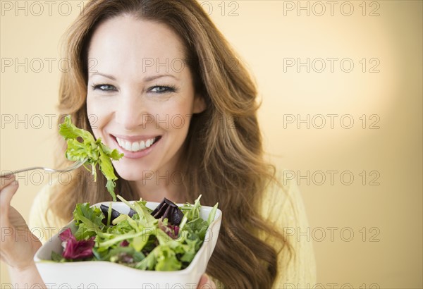 Portrait of woman eating salad.
Photo : Jamie Grill