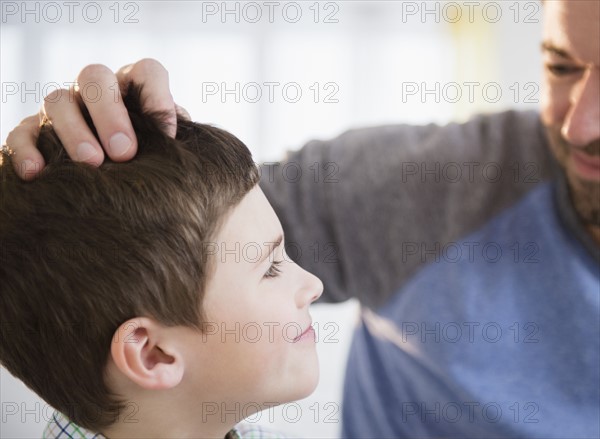 Father looking after son (8-9).
Photo : Jamie Grill