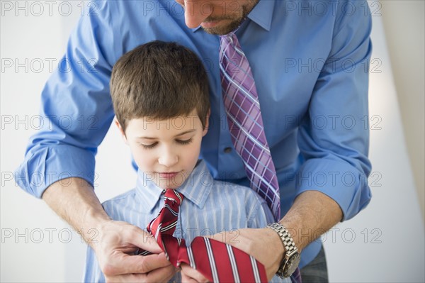 Father adjusting son's(8-9) tie .
Photo : Jamie Grill