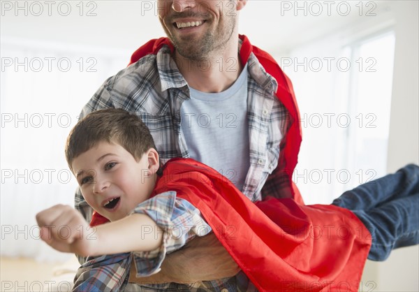 Father and son (8-9) acting as super heroes.
Photo : Jamie Grill