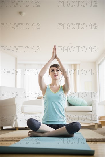 Young woman practicing yoga.
Photo : Jamie Grill