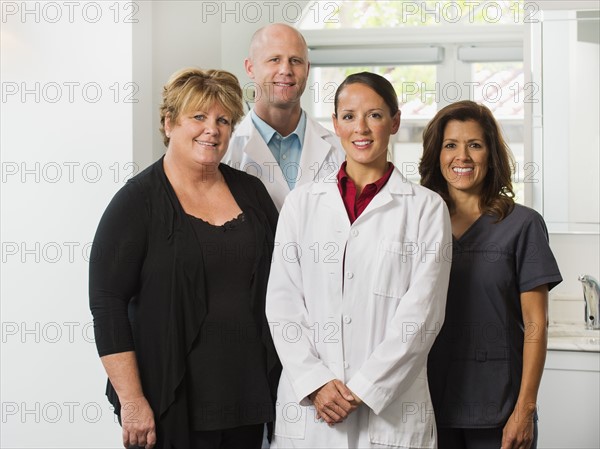 Portrait of dentists and assistants.