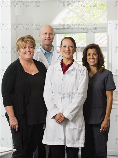 Portrait of dentists and assistants.