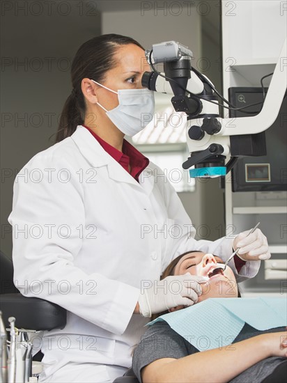 Dentist operation on patient.