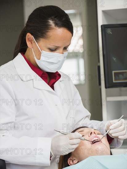 Dentist operation on patient.