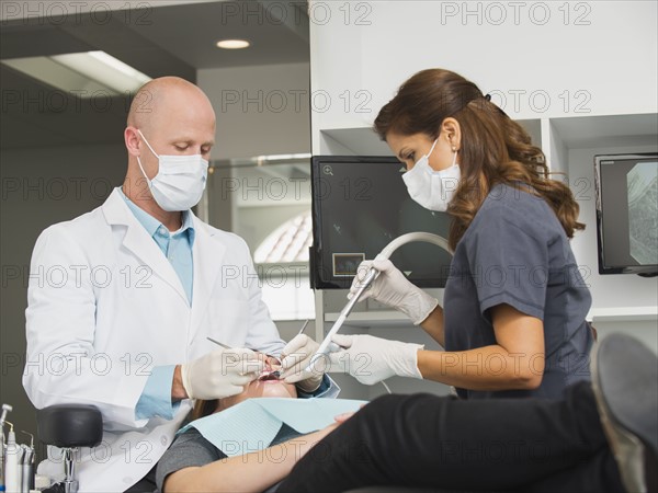 Dentist operation on patient.