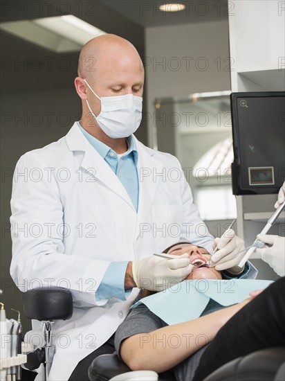 Dentist operation on patient.