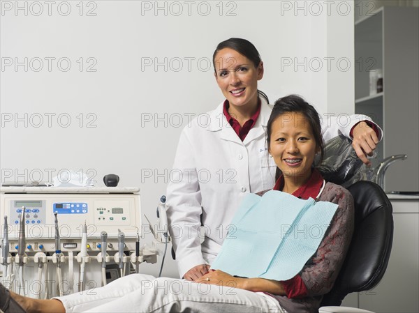 Portrait of dentist with patient.
