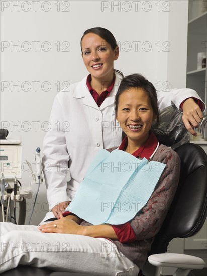 Portrait of dentist with patient.