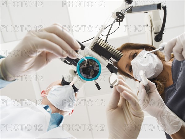 Lowe angle view of dentist and assistant.