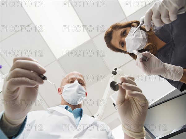 Lowe angle view of dentist and assistant.