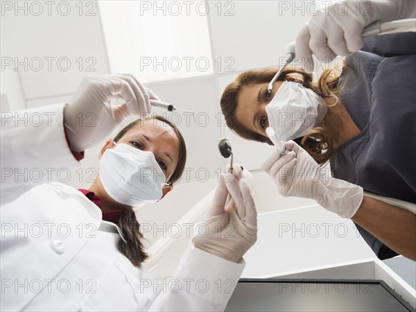 Lowe angle view of dentist and assistant.