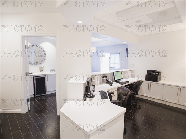 View of empty reception desk in clinic.