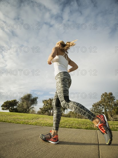 Woman running in park.