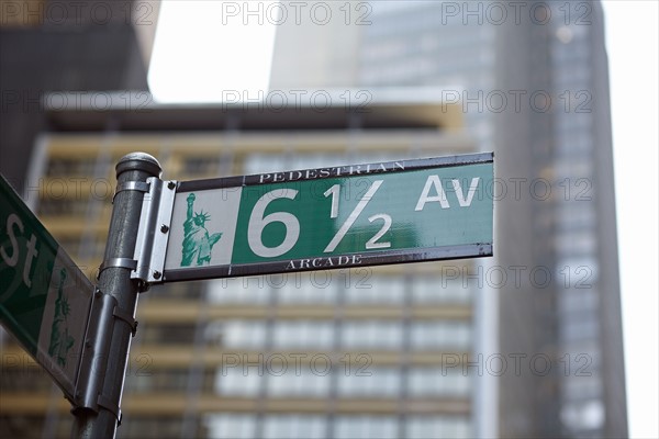 Low angle view of street name sign .
Photo :  Winslow Productions