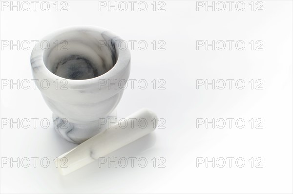 Studio shot of mortar and pestle.
Photo : Tetra Images