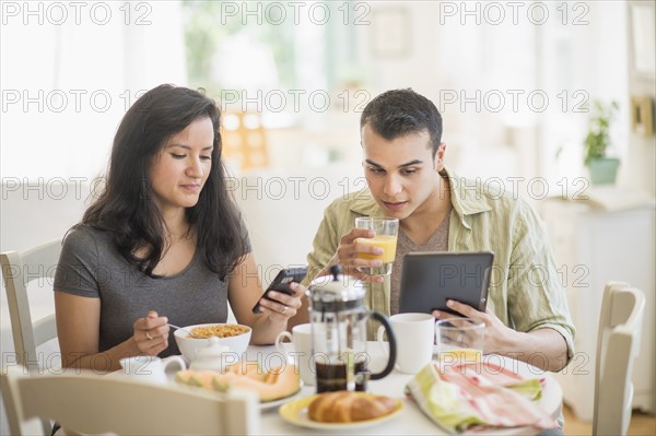 Couple in dining room.