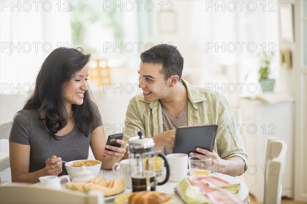 Couple in dining room.