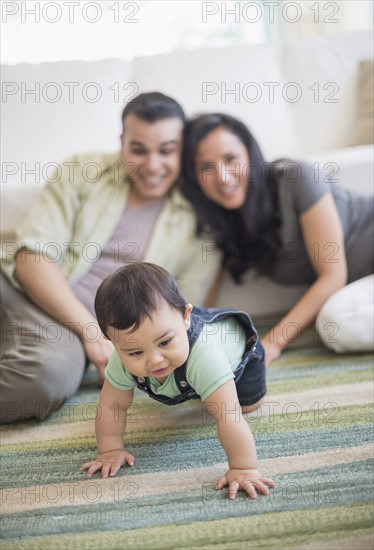 Family with baby son (6-11 months) in living room.