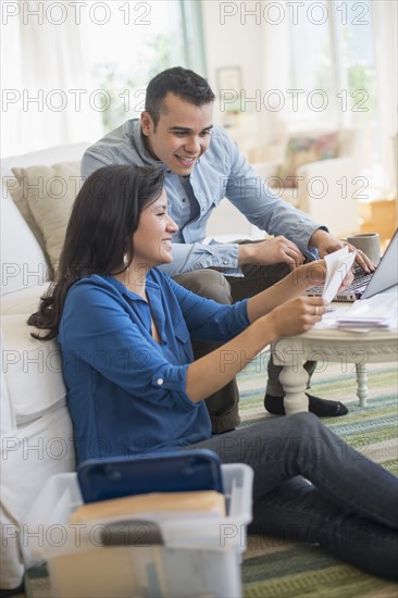 Couple working in living room.