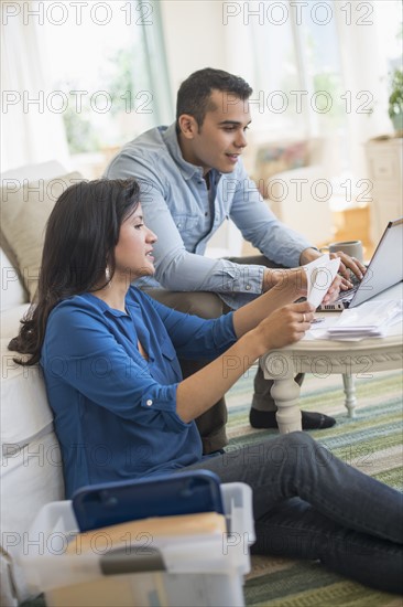 Couple working in living room.