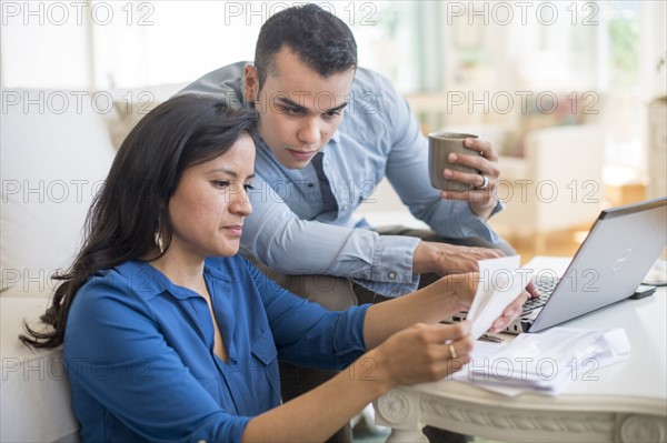 Couple working in living room.