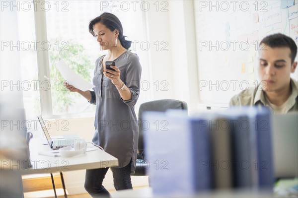 Couple working in office.