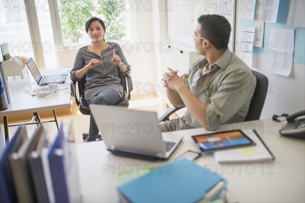 Couple working in office.