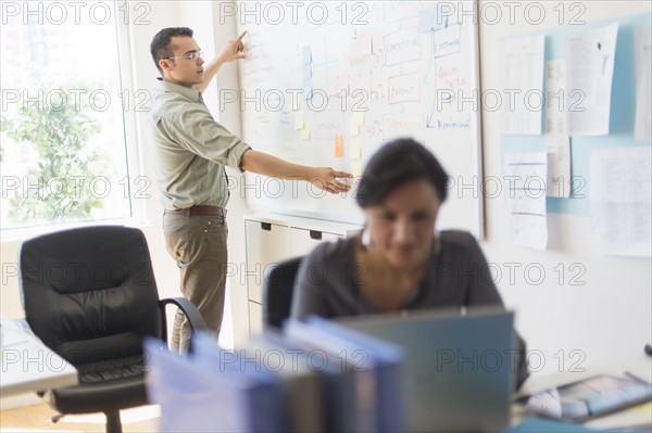 Couple working in office.