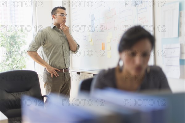 Two people working in office.