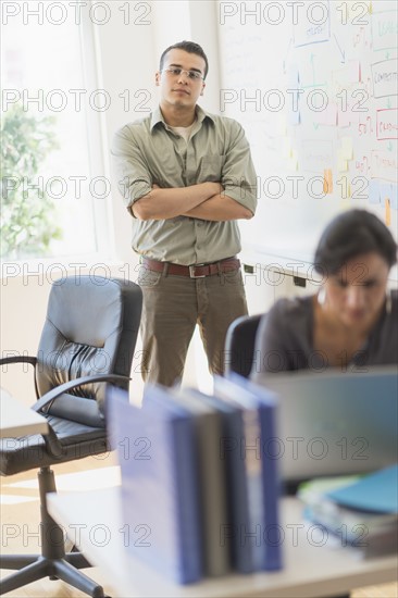 Two people working in office.