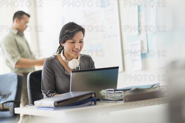 Two people working in office.