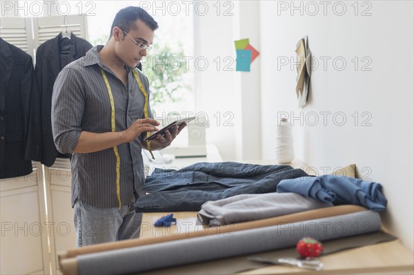 Fashion designer in his studio.