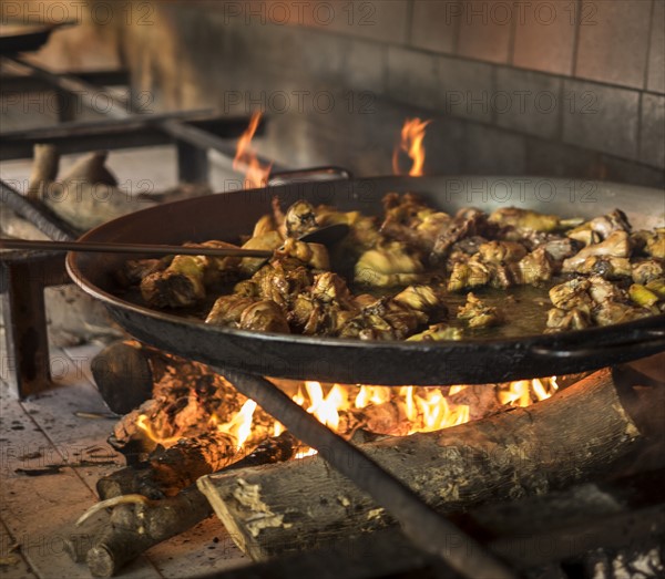 Paella on open fire stove. Valencia, Spain.