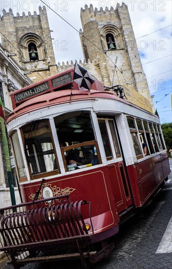 Tram in front of Lisbon Cathedral. Lisbon, Portugal.