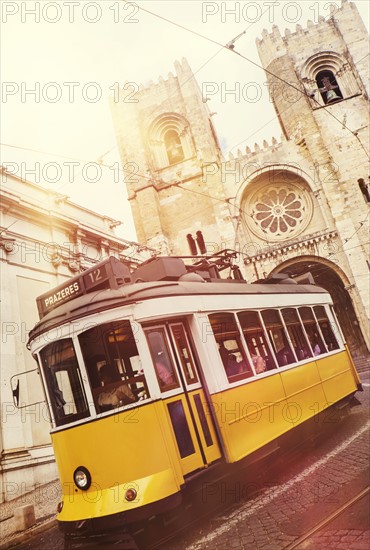 Tram in front of Lisbon Cathedral. Lisbon, Portugal.