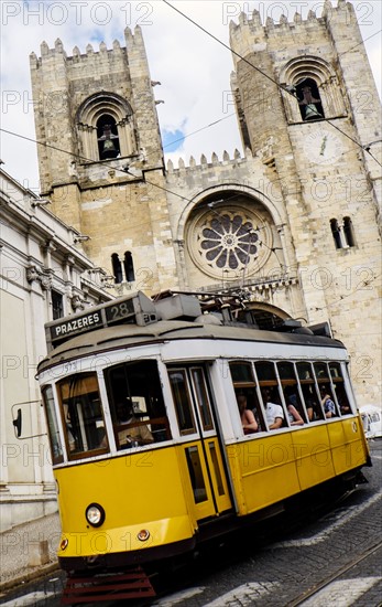 Tram in front of Lisbon Cathedral. Lisbon, Portugal.