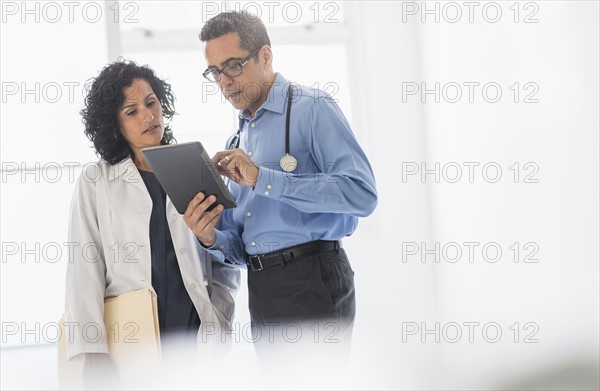 Female and male doctors working together.