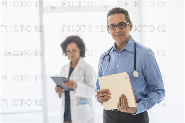 Female and male doctors in hospital.