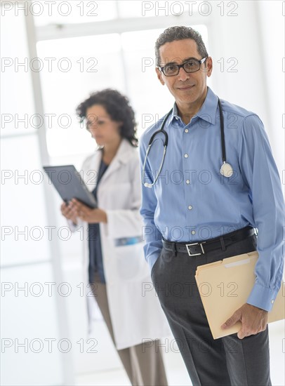 Female and male doctors in hospital.