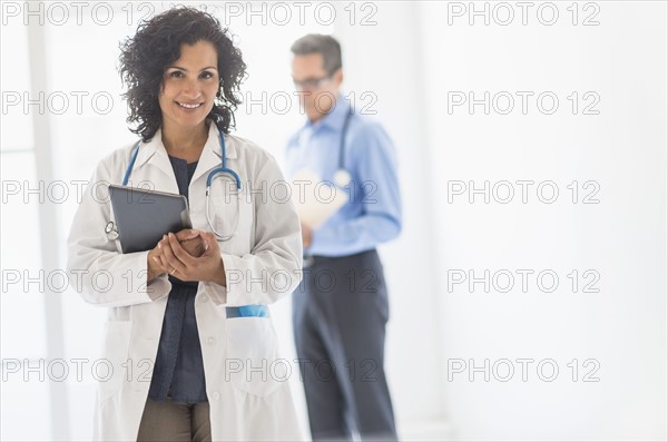 Female and male doctors in hospital.